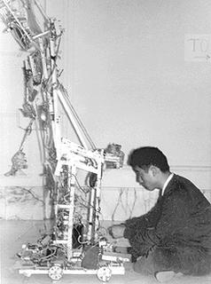 Nam June Paik works on the Robot K-456